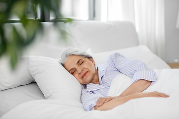 Image showing senior woman sleeping in bed at home bedroom