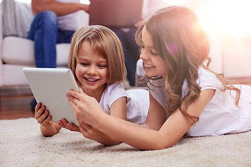 Image showing happy little girls with tablet pc computer at home