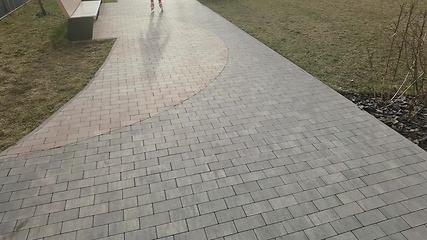 Image showing Little girl in roller skates at a park