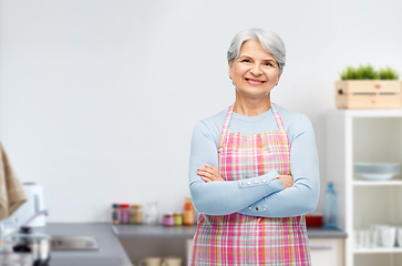 Image showing portrait of smiling senior woman at kitchen