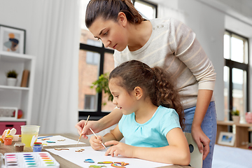 Image showing mother with little daughter drawing at home