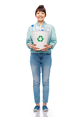 Image showing smiling young woman sorting plastic waste