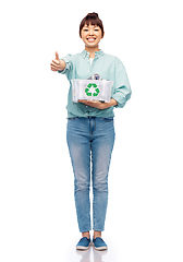 Image showing smiling young asian woman sorting metallic waste