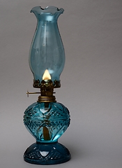 Image showing burning vintage oil lamp on neutral