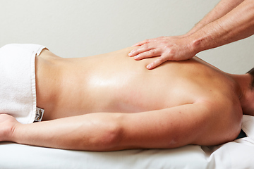 Image showing a massage therapist makes a man massage spa treatment health