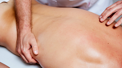 Image showing a massage therapist makes a man massage spa treatment health