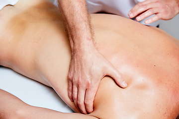 Image showing a massage therapist makes a man massage spa treatment health