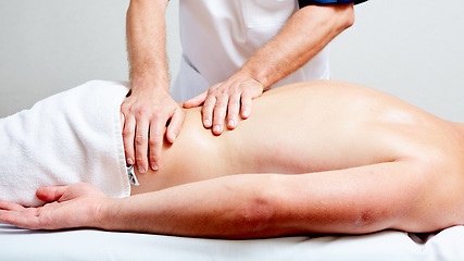 Image showing a massage therapist makes a man massage spa treatment health