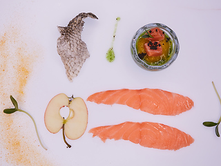 Image showing Puree from apples and greens with salmon cubes. Conceptual aperitif.