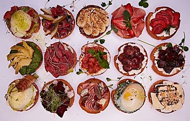 Image showing Crostini with different toppings on white background. Delicious appetizers.