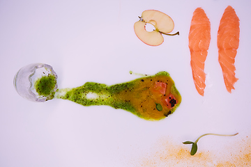 Image showing Puree from apples and greens with salmon cubes. Conceptual aperitif.