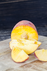 Image showing cut into pieces ripe peach