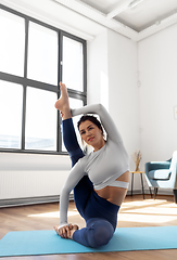 Image showing young woman doing yoga at studio