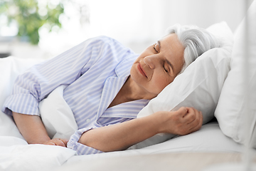 Image showing senior woman sleeping in bed at home bedroom