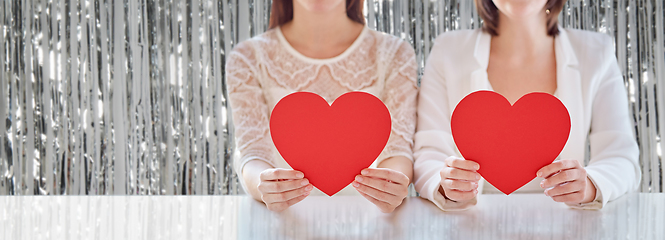 Image showing close up of happy lesbian couple with red hearts