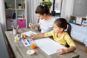 Image showing mother with little daughter drawing at home