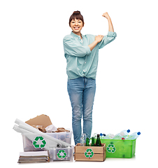 Image showing happy woman sorting paper, metal and plastic waste