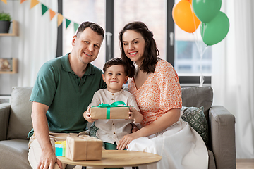 Image showing parents giving birthday present to little son