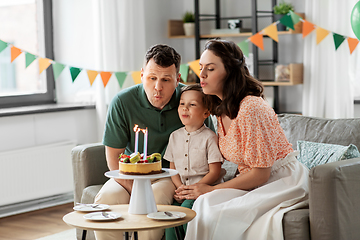 Image showing happy family with birthday cake at home