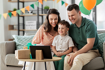 Image showing happy family with tablet pc at home on birthday