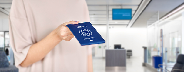 Image showing close up of woman holding immunity passport