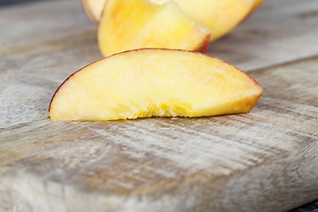 Image showing cut into pieces ripe peach