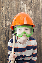 Image showing boy in a helmet and hammer