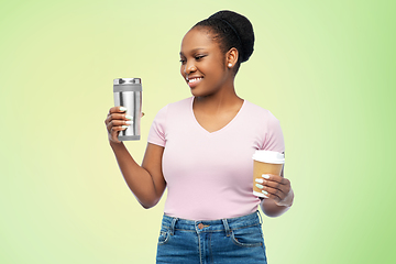 Image showing woman with coffee cup and tumbler for hot drinks