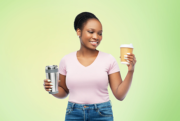 Image showing woman with coffee cup and tumbler for hot drinks