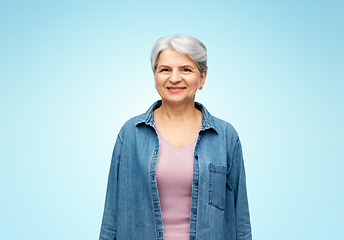 Image showing portrait of smiling senior woman in denim shirt