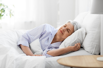 Image showing senior woman sleeping in bed at home bedroom