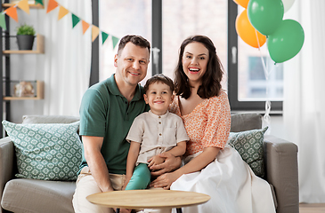 Image showing happy family with little son at birthday party