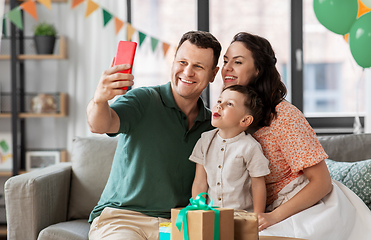 Image showing happy family taking selfie on birthday at home