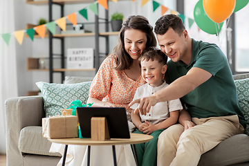 Image showing happy family with tablet pc at home on birthday