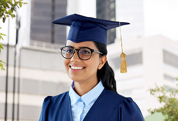 Image showing happy female graduate student in mortarboard