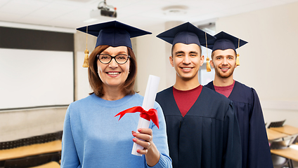 Image showing happy graduate students woman with diploma