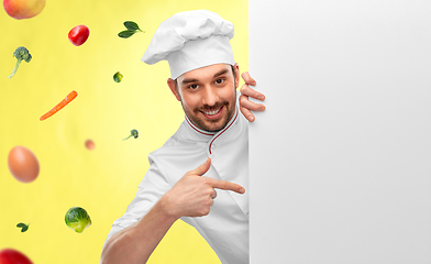 Image showing happy smiling male chef with big white board