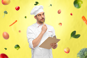 Image showing thinking male chef with clipboard