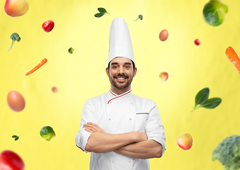 Image showing happy smiling male chef in toque with crossed arms