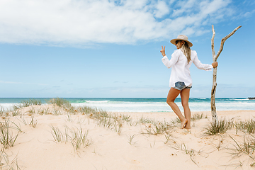 Image showing Woman on pristine seculuded beach Australia good vibes