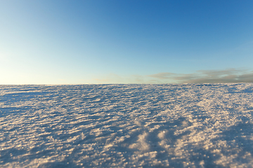 Image showing uneven drifts of white snow