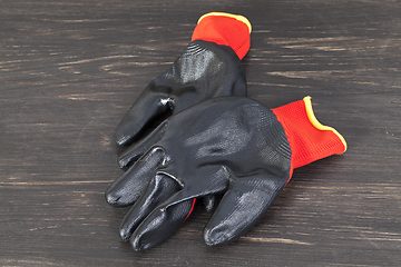 Image showing black and red protective gloves