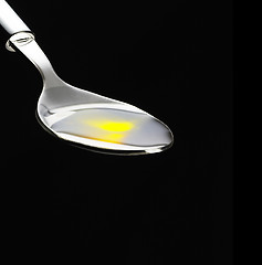 Image showing olive oil on a spoon