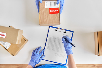 Image showing customer making return of parcel or purchase