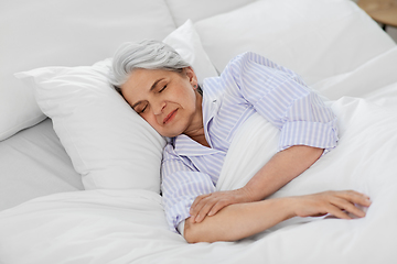 Image showing senior woman sleeping in bed at home bedroom