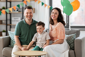 Image showing happy family with little son at birthday party