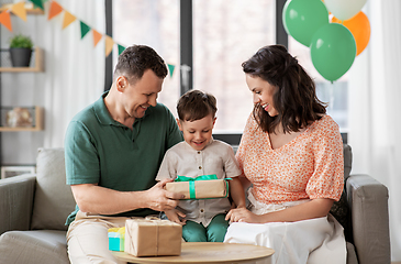 Image showing parents giving birthday present to little son