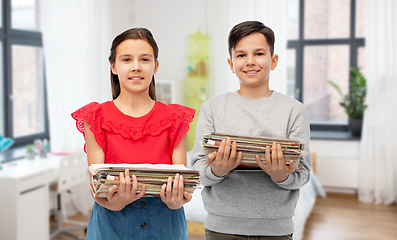 Image showing happy children with magazines sorting paper waste