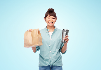 Image showing woman with thermo cup or tumbler for hot drinks