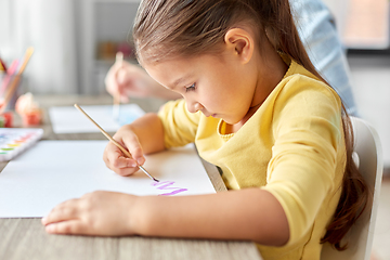 Image showing little girl drawing picture with colors and brush